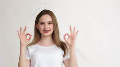 Ok gesture agreement sign amused teen girl deal