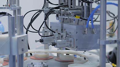 Automatic vacuum capping machine during work at package exhibition - demo mode