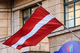 Flag of Latvia waves in Riga city