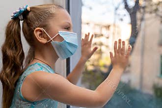 Girl child hygienic mask stay isolation at home for self quarantine for protect against virus COVID-19and air pollution