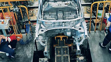 Car moving along the assembly line at a car factory