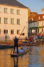 Leisure activity of punting on River Cam at Cambridge nearby Silver Street, United Kingdom