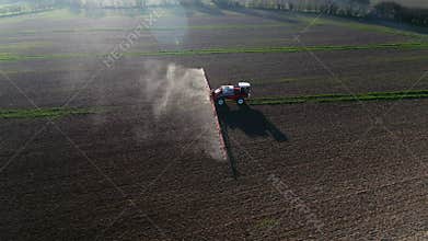 Tractor Spraying Fields on an Arable Farm with Glyphosate Herbicide