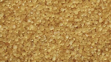 Golden cane sugar crystals full frame close up