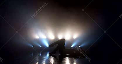 Woman dancing strip plastic on stage