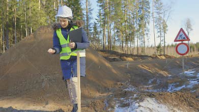 Woman civil engineer take sample