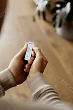Man at home checks a covid-19 rapid antigen device