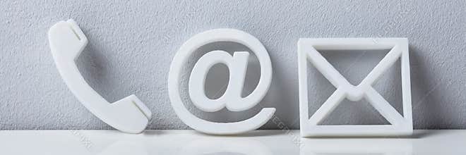 Close-up Of A Phone, Email And Post Icons. Contact Us