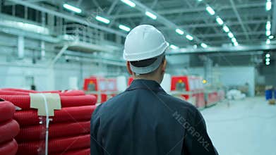 Follow footage of asian employees male warehouse worker engineer in hard hat working