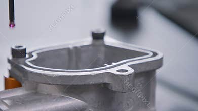 CMM measuring machine probing a high precision metal part