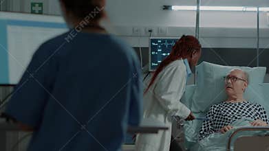 African american medic talking to nurse about patient diagnosis