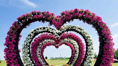 Decorating a Festive Arch. Wedding Decoration with Bouquets of Natural Fresh Flowers for a Family Feast, Decor in garden