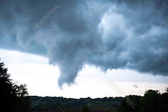 Upcoming tunderstorm with dark rain clouds - cumulonimbus clouds - and heavy rainfall