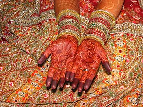 Indian bride's beautiful hand with henna tattoo