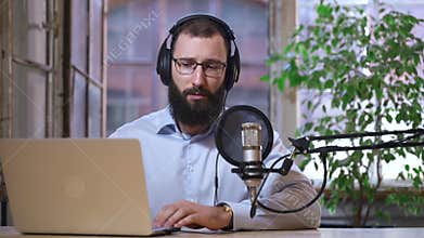 Podcasting of topical programme man presenter with laptop Spbas