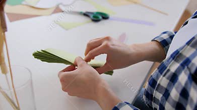 woman making paper craft at home