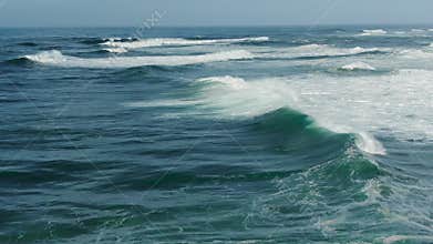 picturesque ocean with rolling waves on sunny day upper view