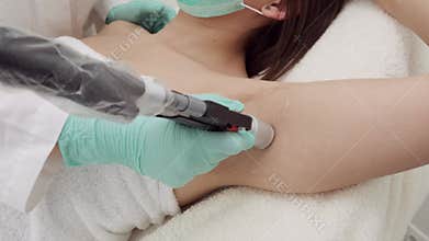 Cosmetology. Armpit laser hair removal. Beauty clinic.