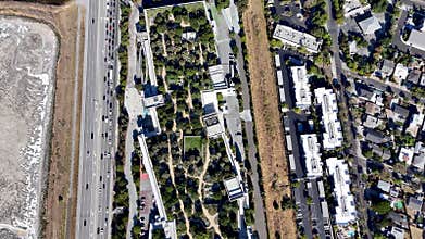 Meta MPK 21 top-down view with green rooftop garden, highway, and residential area