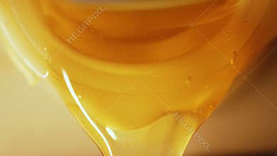 Manual centrifuge extractor, fresh honey pouring from metal opened pipe mouth after extraction. Harvesting Natural