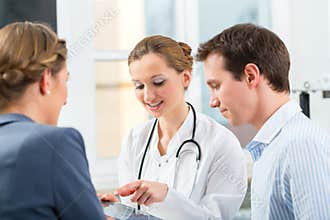 Doctor with patients in a consulting in clinic