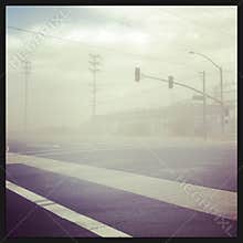 Dust Storm Across a Country Road