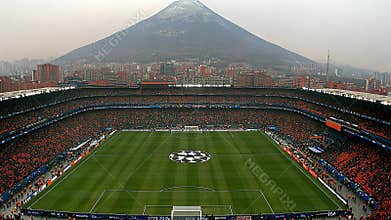 Exciting Champions League Match Day With Stunning Views of the Stadium and the Majestic Mountain in the Background