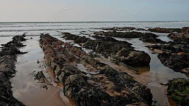 Rocky beach soon covered by sea tide