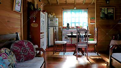 Wooden house hut from inside with furniture kitchen seating decoration