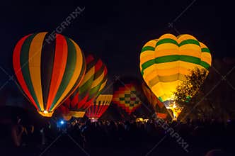 Bright Hot Air Balloons Glowing at Night