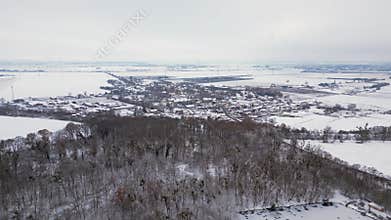Winter Village Snow houses road, cloudy sky. Great aerial top view flight drone