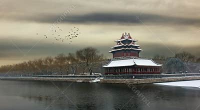 The Forbidden City in Beijing at dusk after snow.
