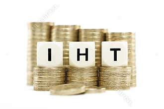 IHT (Inheritance Tax) on gold coins on white backg