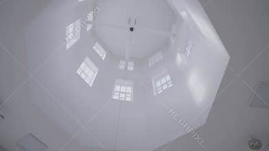 High white ceiling with windows. Interesting domed ceiling with windows inside. Interior of planetarium, library.