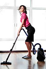 Young Woman with Vacuum Cleaner