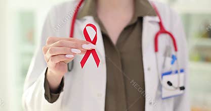 Information tape for World AIDS Day in the hands of a doctor
