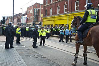 Police Chief Inspector commanding riot policemen