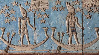 Ancient Egyptian hieroglyphs and bas-reliefs close-up in Dendera temple or Temple of Hathor. Egypt. Dendera Temple