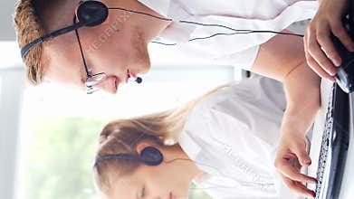 Diverse team of young professionals is working in the phone support office. Working day of sales managers in the call