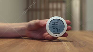 Thermohygrometer, electronic home device showing indoor climate, good warm temperature,