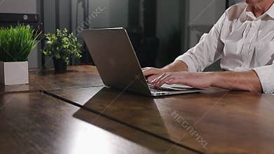 Opening modern silver laptop computer, starting work.