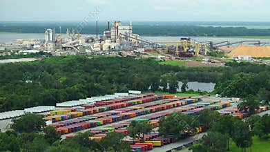 Cargo container freight yard at Brunswick cellulose plant in Georgia, USA. Shipment of products from paper mill factory