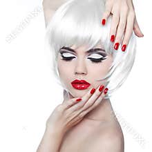 Makeup and Hairstyle. Red Lips and Manicured Nails. Fashion Beau