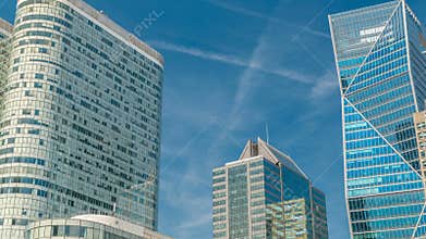 Modern skyscrapers timelapse in famous financial and business district of Paris - La Defense.