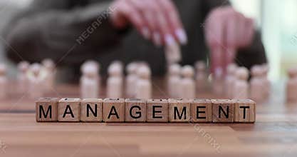 Woman changes places of pawns by word Management on table