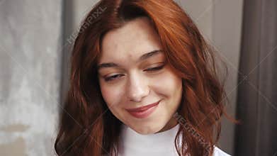 Portrait of beautiful caucasian woman smiling looking up at camera with happy emotion enjoying successful lifestyle