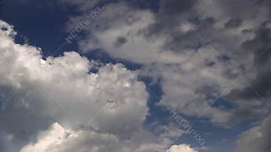 The skies. Fast moving clouds on the blue sky