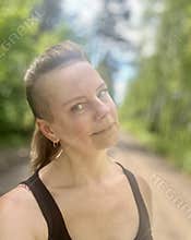 a 50-year-old woman sunbathing in the sun