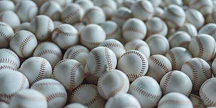 Bunch of white baseballs in pile. Close-up. Background, wallpaper. Top view. Baseball balls