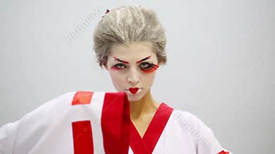 Close up of woman in kimono with make up of geisha
